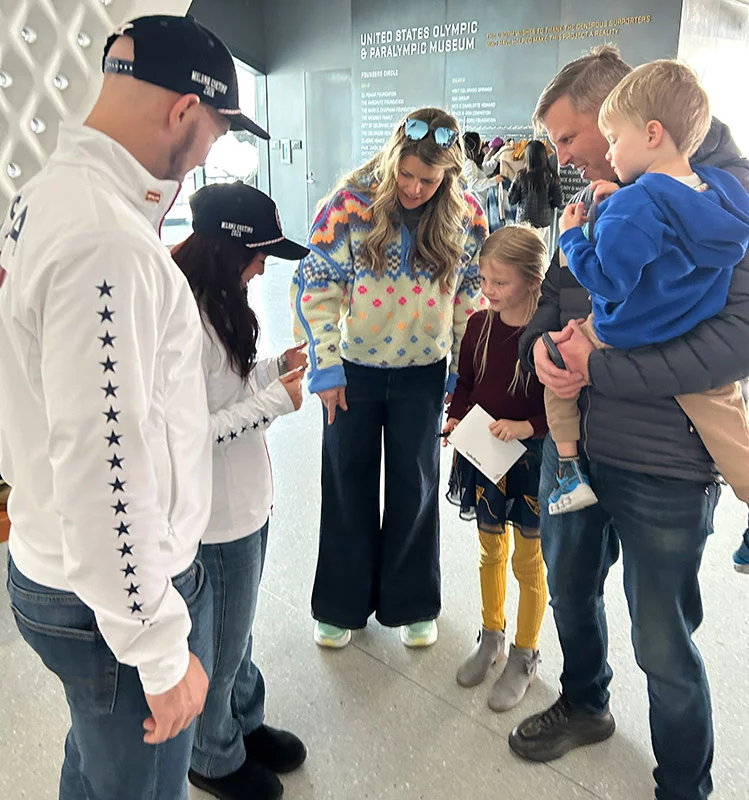 Sage Thomas, 7, made a card for Ellie Kam and her skating partner, Danny O'Shea, and presented it to the skaters during a sendoff celebration at the United States Olympic & Paralympic Museum in Colorado Springs. Sage's dad works with Ellie's dad, Dr. Benjamin Kam. Photo by Katie Kerwin McCrimmon, UCHealth.