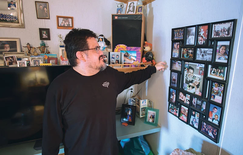 In his home filled with family photos, Joseph reflects on the support that helped him survive heart failure. His transplant at 35 has given Joseph new energy. He is eager to explore more, both in the Four Corners region, and on trips around the world. Photo by Donovan Quintero, for UCHealth.