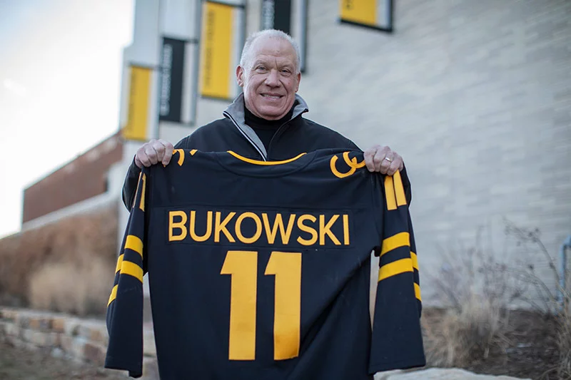Mike and his family's plumbing and heating company in Colorado Springs have been supporters of the Colorado College Tigers hockey team since the 1940s. After learning of his stroke, CC leaders had a hockey jersey made for Mike with his name on the back. Photo by Anslee Wolfe, for UCHealth.