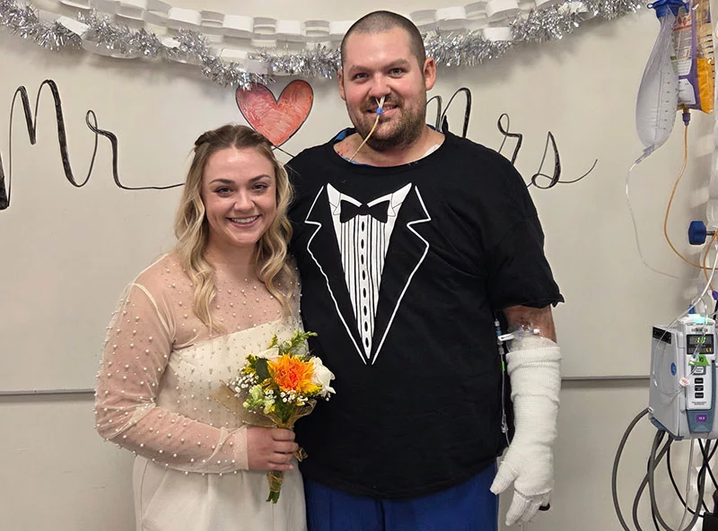 Ben and Courtney planned to elope on Dec. 20. Then Ben had to be hospitalized after suffering burns in an oil field accident in Wyoming. With help from hospital staffers and family members, the couple decided to go ahead with a wedding ceremony in the hospital on Dec. 23. Photo courtesy of Ben and Courtney Argento.