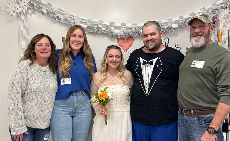 Ben and Courtney pose with family members after their hospital wedding. Photo courtesy of Ben and Courtney Argento.