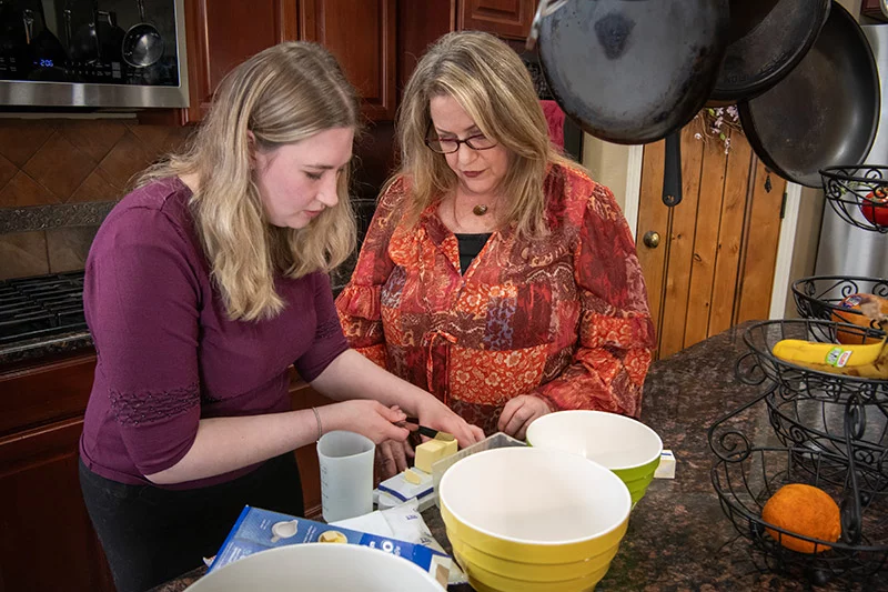 Aubriana loves spending time in the kitchen with her mom, especially if it involves baking a dessert. Those moments give them a chance to unwind, talk and celebrate how far she has come. Photo by Chuck Bigger, for UCHealth.