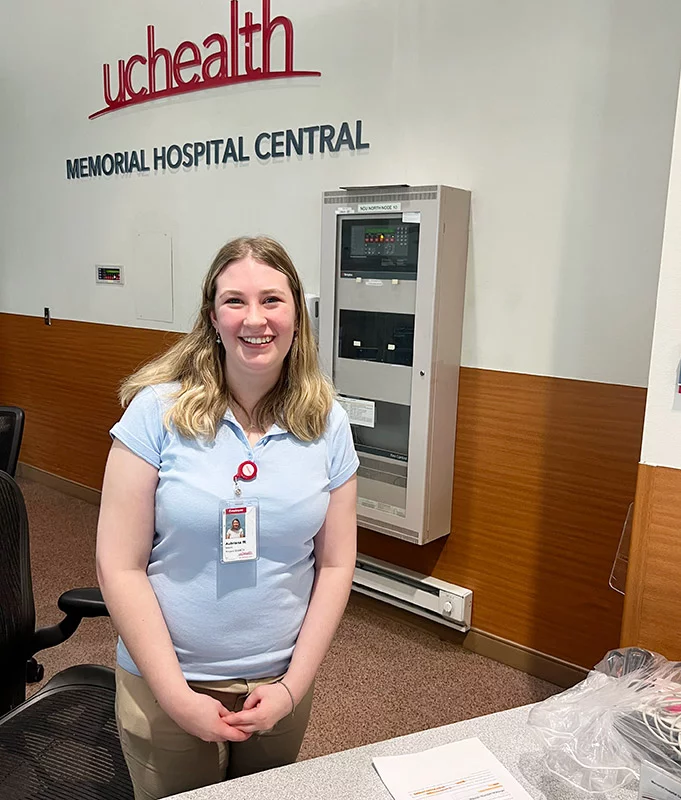 Aubriana greets every patient or visitor with a smile and helps them find their way through Memorial Hospital Central. Her Project SEARCH internship includes shifts at one of the registration desks as well as classroom time where she learns job and life skills. Photo by Joanna Bean, UCHealth.