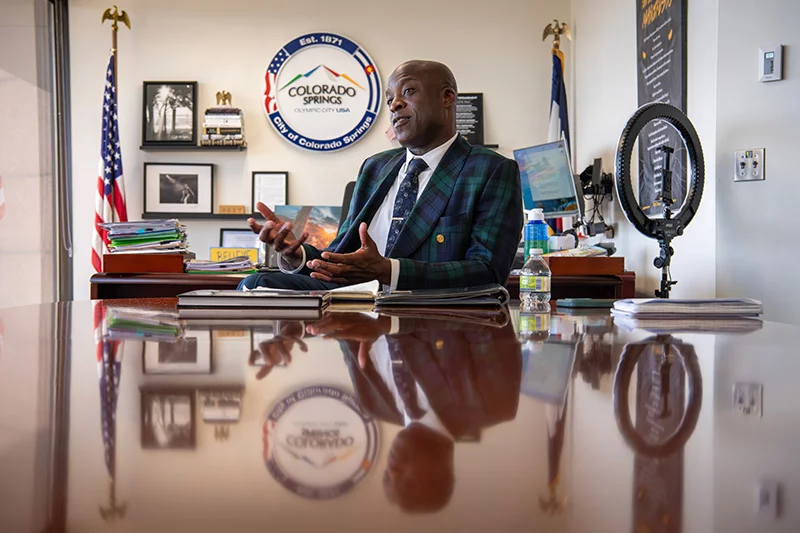 Mobolade, 47, was sworn in as the youngest mayor in Colorado Springs history in June 2023. As the second anniversary of his term in office approached, Mobolade was working long days and feeling sicker by the day. After being hospitalized for double pneumonia and learning he had heart blockages, Mobolade changed his approach to leadership at the city. “It was healthy for the team. I didn’t have to be at the center of every decision anymore.” Photo by Chuck Bigger, for UCHealth.