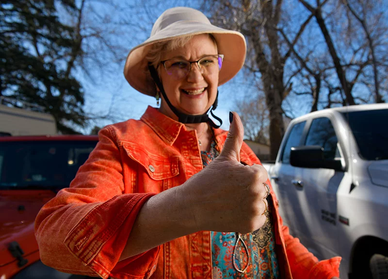 Delgado gives a thumbs-up review of her Touch CMC 1 prosthesis, something that would have been painful before her Touch CMC 1 prosthesis. Photo by Cyrus McCrimmon for UCHealth.