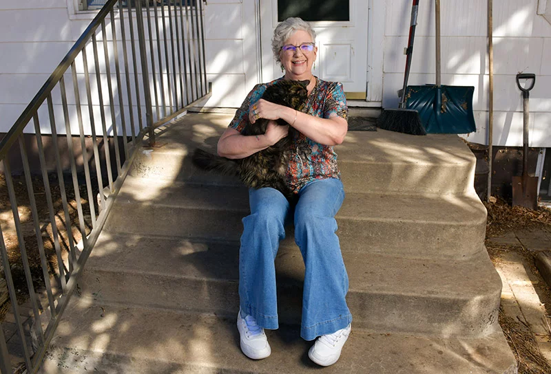 Traceyrené can pick up her cat much more easily now. She's looking forward to getting surgery on her left thumb soon. Photo by Cyrus McCrimmon for UCHealth.