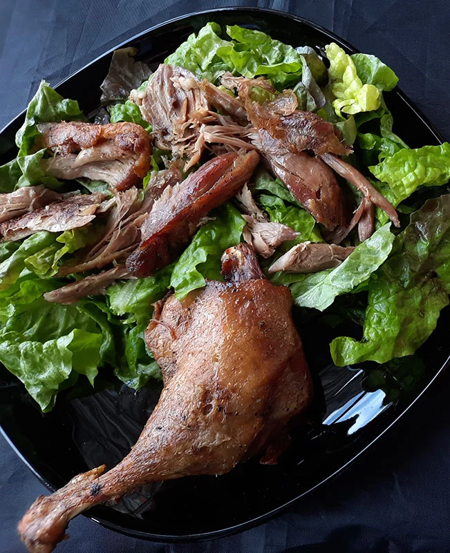 Confit of duck is classic with salad green. Photo by Bill St. John, for UCHealth.