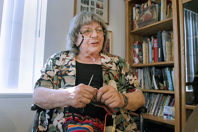 Ute Willmore is a former software engineer who enjoys knitting and crocheting practical items like socks, potholders and reusable grocery bags, filling her home with projects made by hand. Photo by Joel Blocker, for UCHealth.
