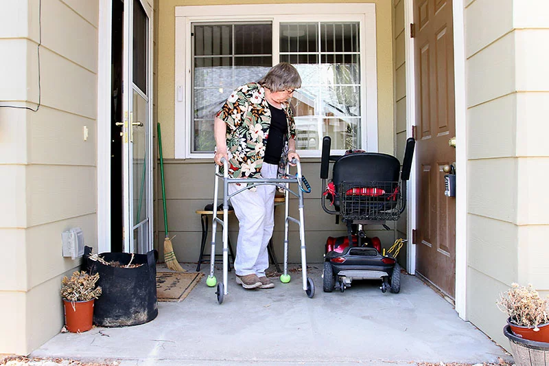 After slipping and falling in early 2026, Ute broke her artificial hip joint. After surgery, she had to rely for a short time on a wheelchair. During surgery, doctors discovered a low‑grade infection that had gone undetected and was likely contributing to Ute's leg pain. These days, with support from her care manager, she's doing better. Photo by Joel Blocker, for UCHealth.