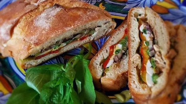 Pan Bagnat, which means “bathed (or soaked) bread” in Occitan, the ancient southern French language, is effectively a Salade Niçoise sandwich. Photo by Bill St. John for UCHealth.