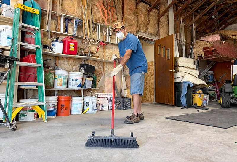 Cleaning out sheds and garages can expose people to hantavirus, a potentially deadly infection carried by rodents. Wearing a mask helps reduce the risk of inhaling contaminated dust. Photo by Joel Blocker, for UCHealth.