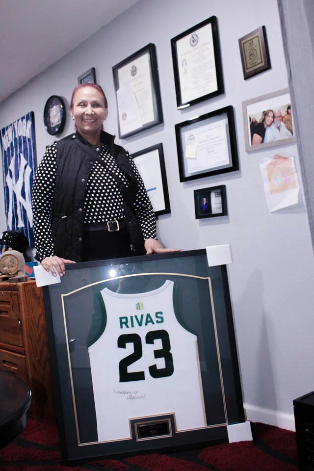 Claudia Rivas proudly displays the jersey worn by CSU basketball player Caitlin Kramer during the Fight Like a Ram game. Photo by Ana Gretchen Robleto Lupiac, UCHealth.