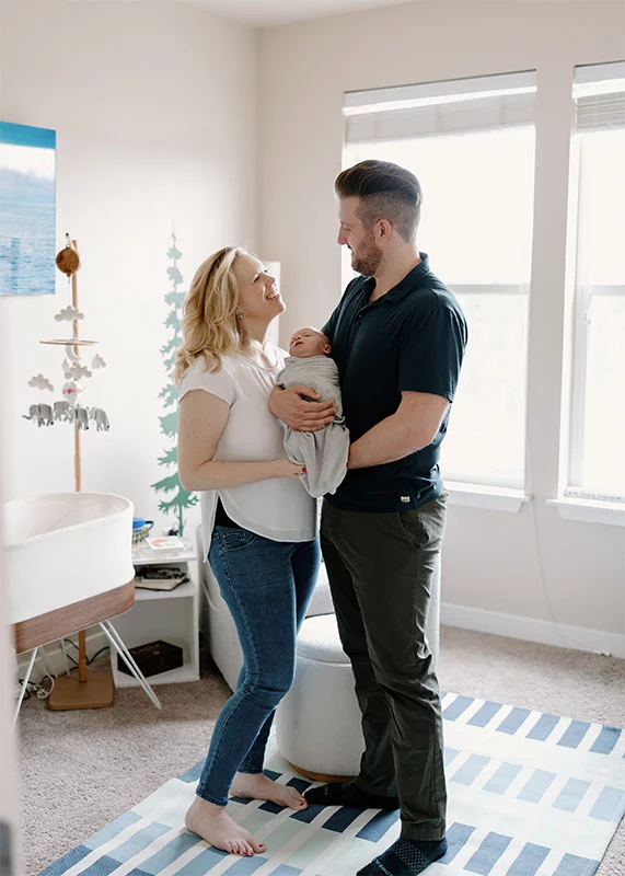 Kayla and Zac pose with their son. Photo by Olivia McGuire, courtesy of Kayla Calkin.