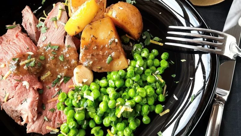 Marinading a leg of lamb with mustard, among other slatherings, adds layers of flavors to the finished dish and its sauce. Photo by Bill St. John. for UCHealth