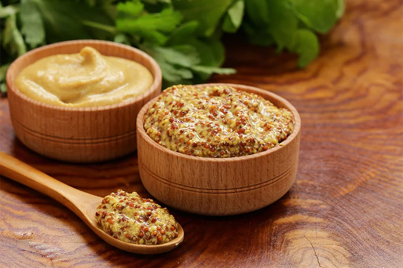 Mustard gets its heat only when crushed and mixed with liquid. And heat mellows mustard's sharpness, turning spicy flavors into something rich and nutty when cooked. Photo: Getty Images.