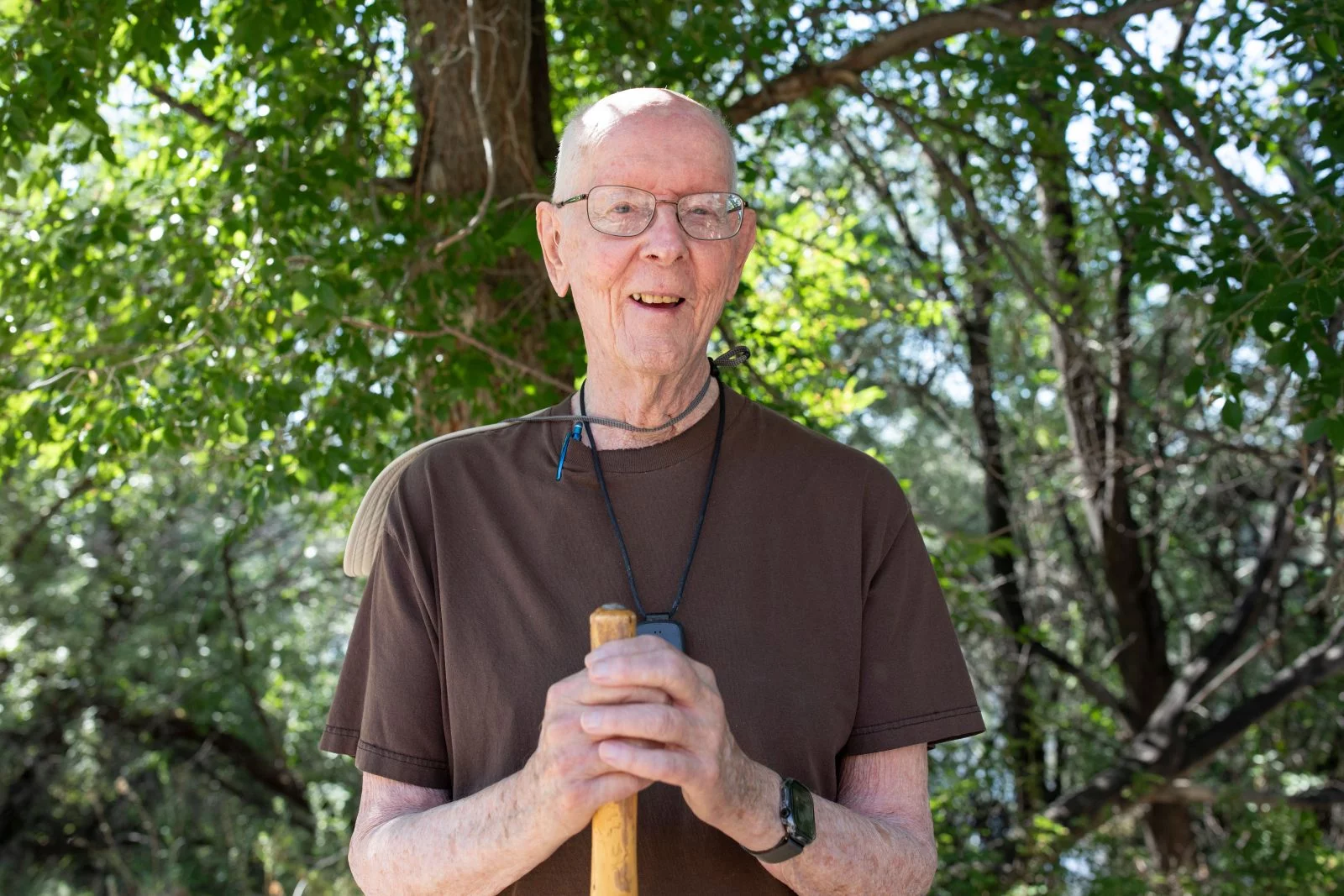 Ray White stands with his walking stick. Each day, Ray White makes sure to exercise, read and pray for other people. "That has kept me intellectually vibrant,” he said. Photo by Anslee Wolfe, for UCHealth.