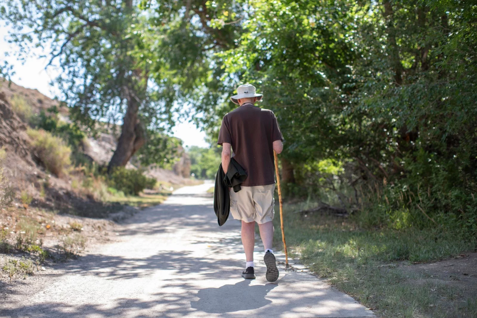 Ray White walking away on one of his favorite walking trails. By early July, Ray White already had logged more than 100 miles toward his 150-mile goal for the Pueblo 150 Challenge. Photo by Anslee Wolfe, UCHealth.