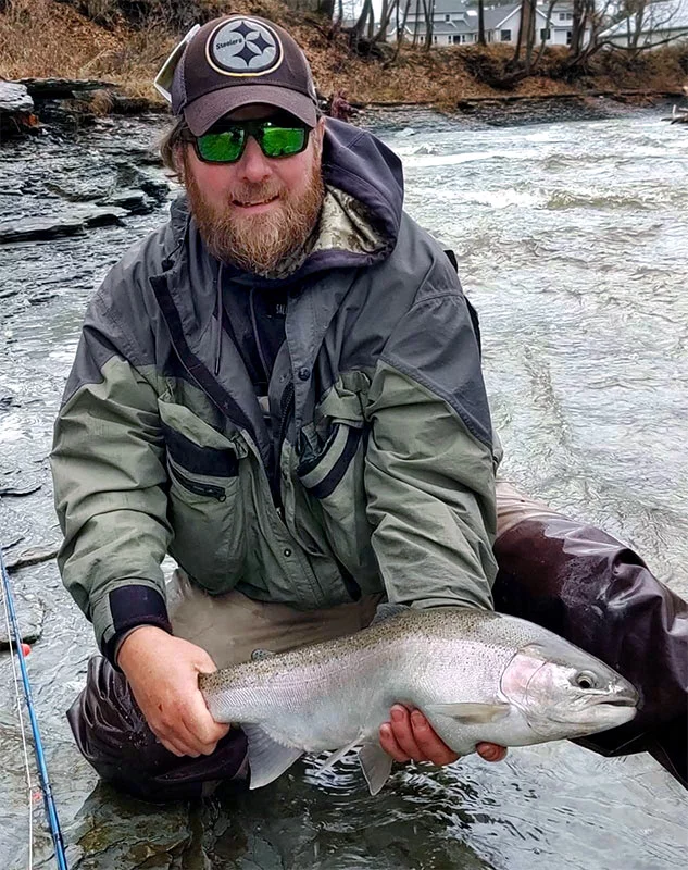 Matt holds a 6 to 8-pound steelhead trout he caught from Lake Erie, Pennsylvania. Photo courtesy of Matt Hogue