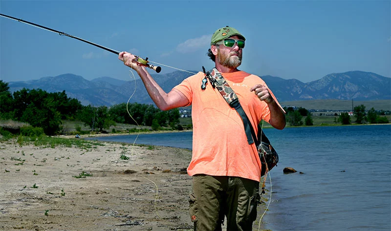 Matt Hogue fly fishing. Matt is a lifelong Pittsburgh Steelers fan. Friends wouldn’t know him without some sort of hat, he says. Photo by Sonya Doctorian, UCHealth.
