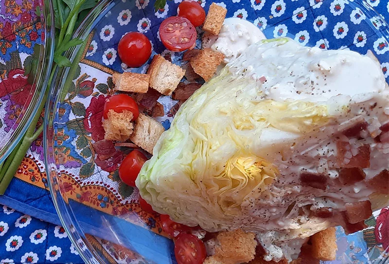 The classic iceberg lettuce wedge salad, with homemade blue cheese dressing. Photo by Bill St. John for UCHealth.