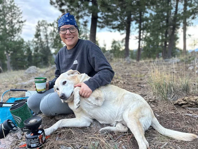 Karissa Goossen camping with her dog. After countless miles traveled for treatment, Karissa Goossen now is focused on healing, rebuilding her strength and embracing life's simple joys. Photo courtesy of Karissa Goossen. 