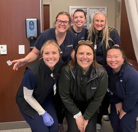 Karissa Goossen, bottom center, says the doctors, nurses and staff who cared for her through multiple cancer diagnoses helped keep her going during the toughest moments of her journey. Photo courtesy of Karissa Goossen. 
