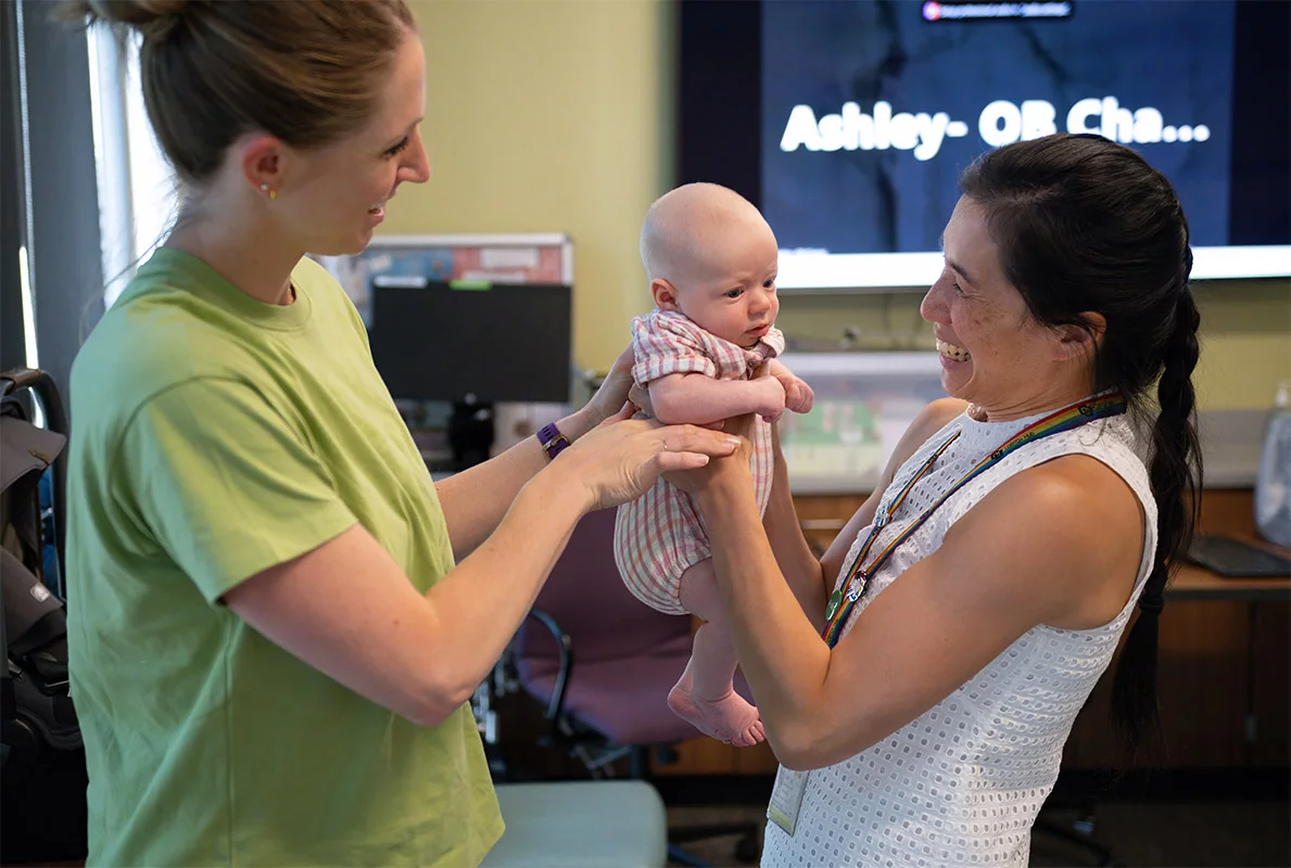 Dr. Vivian Jiang, right, visits with her patient, Erin Melzer, left, and her daughter, Noelle, who was 7 weeks old when Erin attended a class to learn more about breastfeeding. Erin has an older daughter too and said the monthly prenatal classes at UCHealth Family Medicine in Westminster made it much easier for her to navigate the challenges and adjustments after giving birth. Photo by Mark Reis, for UCHealth.