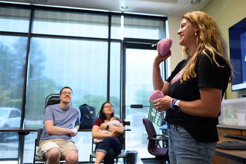Kristin Howorko, a nurse and breastfeeding expert, leads a class for pregant women and those who have recently given birth during a monthly group prenatal visit at UCHealth Family Medicine in Westminster. Photo by Mark Reis, for UCHealth.