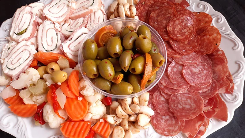 An assortment of antipasti in the Italian way. Antipasti are culinary quickies, an accumulation of which sometimes serves as an entire meal. They are meant not merely to stimulate the appetite, but to sate it. Photo by Bill St. John, for UCHealth.