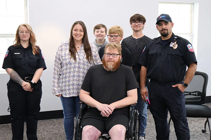 John Mazanec and his family reunited with the AMR Pueblo paramedics who helped save his life with whole-blood treatment, Audrey Nolen, left, and John Trevino, right. He credits dozens of medical providers in Pueblo and Colorado Springs who saved his life. Photo by Todd Seip, UCHealth.