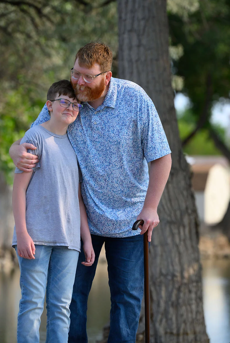 William gets a hug from his dad John Mazanec, who survived a terrible motorcycle thanks to a new program that helps paramedics provide whole blood to patients who need immediate help. Photo by Mark Reis, for UCHealth.