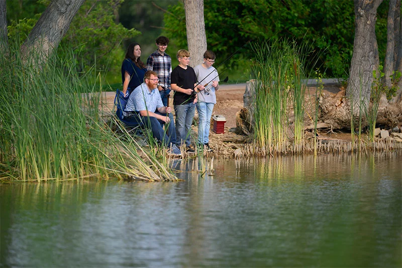 John Manzanec and his family have returned to many of their favorite rituals and pastimes since his accident last fall, including fishing together. Photo by Mark Reis, for UCHealth.