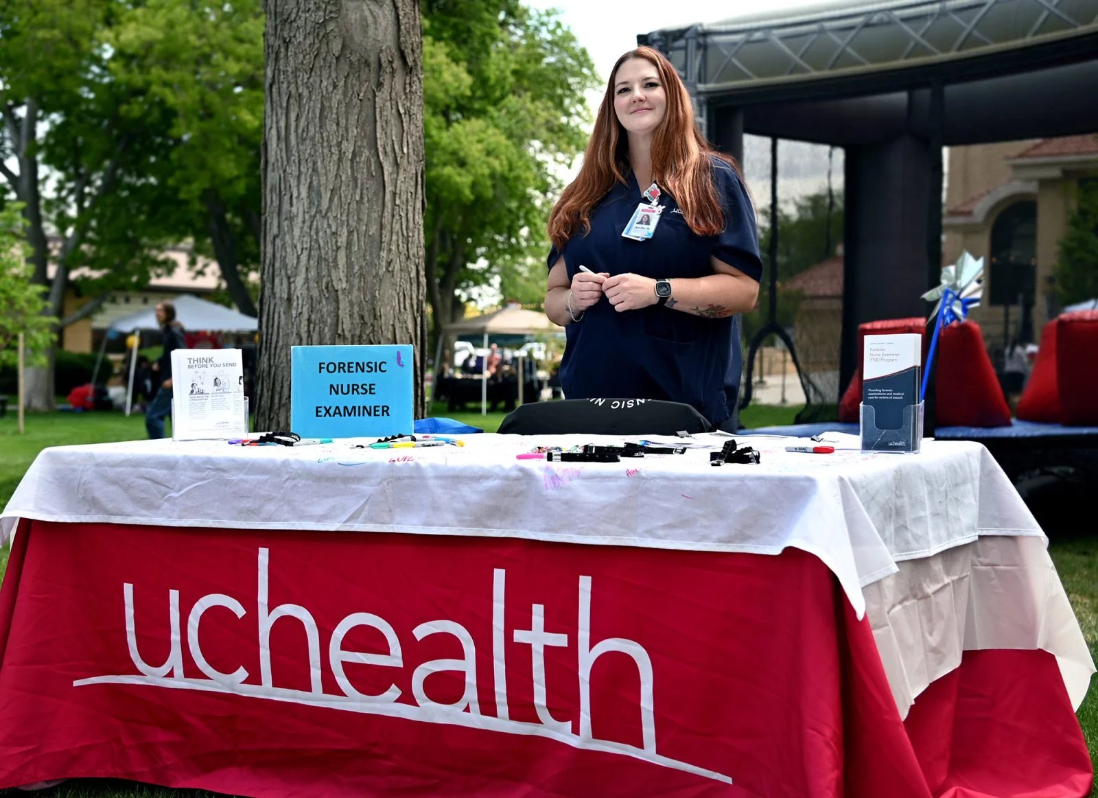 Jenifer Bartell with UCHealth Parkview hosts a booth at a public outreach event
