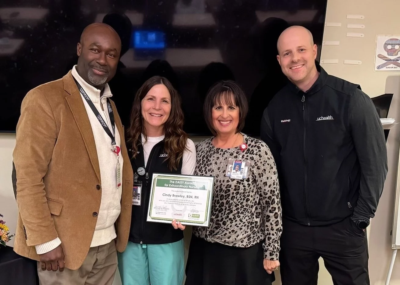 Cindy Brawley celebrates her recognition in a photo with leadership