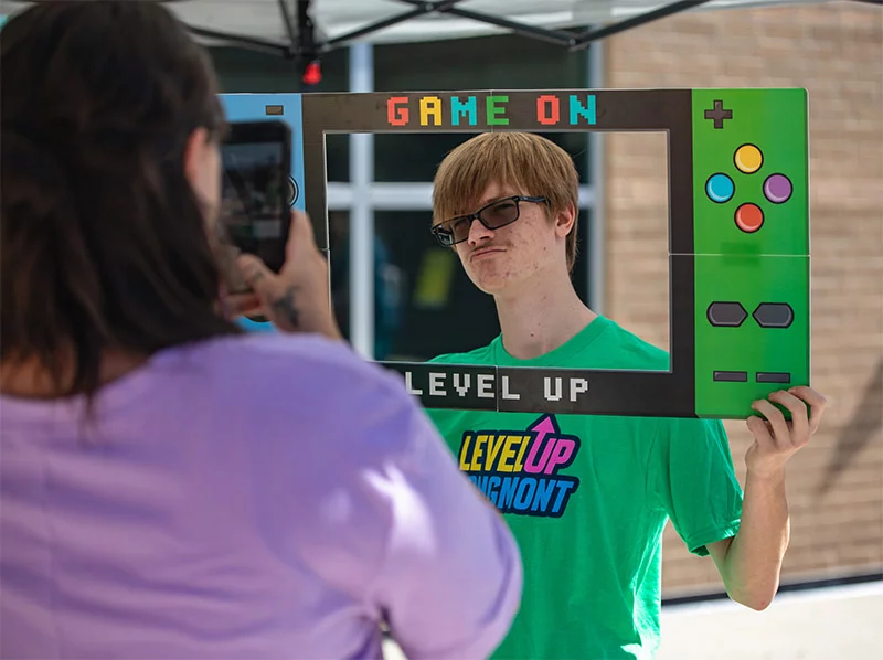Person getting their photo taken at the 2025 event. LevelUp Longmont is a fun esports-based event with lots to check out. Photo by Matt Maenpaa, courtesy of Longmont Public Library.