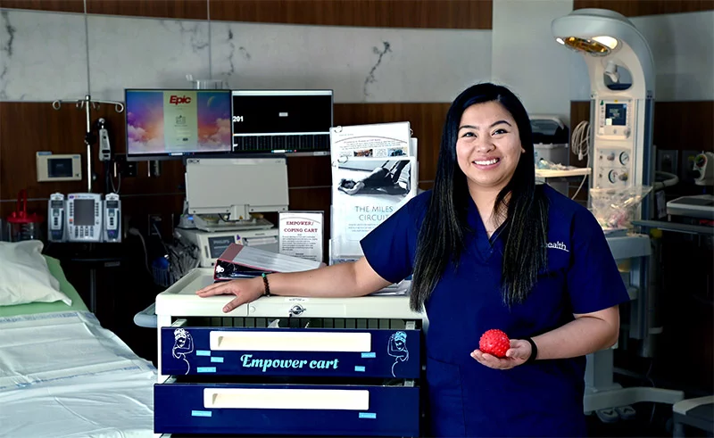 Angel Armamento pictured with the cartAngel Armamento. Photo by Sonya Doctorian, UCHealth.