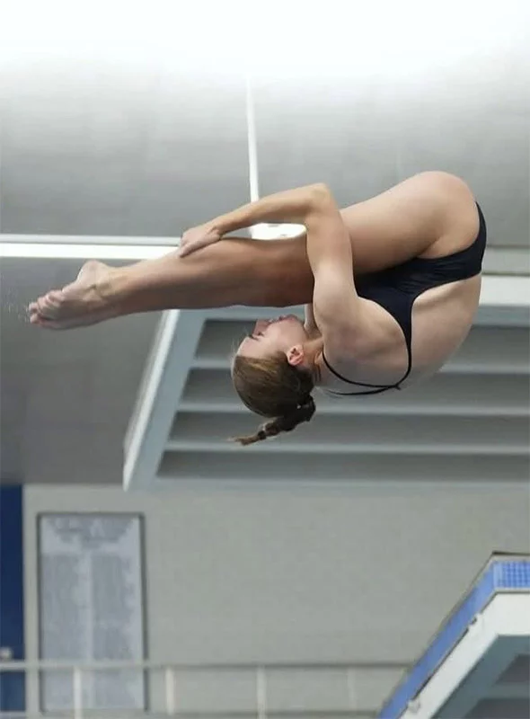 Kadyn photographed in mid-air during a dive.Photo courtesy of MacPherson family.
