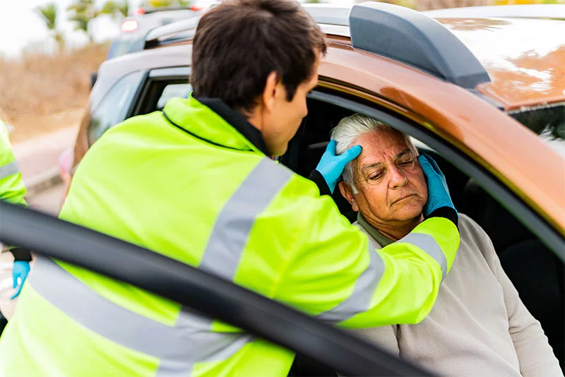 parametic assessing a man in a car accident for possible brain injury. ER doctors in Colorado Springs are using a new blood test for possible brain injuries that can save patients time and money.