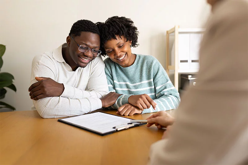 Couple receiving preconception care from a maternal-fetal physician. Preconception care can help women build confidence and make a plan for pregnancy, especially if they are managing health conditions or face a difficult pregnancy. Photo: Getty Images.