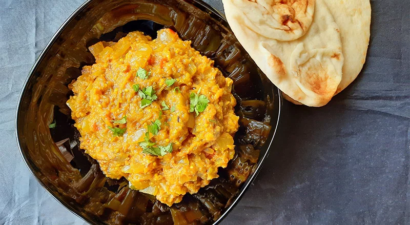 Baigan Bharta, a classic Indian eggplant dish using fresh chile peppers. Photo by Bill St. John for UCHealth.