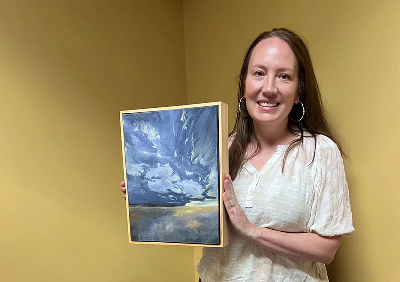 Dr. Renna Becerra, a UCHealth doctor who works with the medical school students, submitted one of her paintings for the art show. Photo by Joanna Bean, UCHealth.