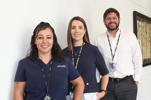 The UCHealth Hispanic Transplant Program staff provides support throughout the transplant process. From left to right, Lindsay Munoz, a transplant coordinator, Gladiz Martinez, a clinical nurse specialist, and Dr. Sixto Giusti Torres, director of the Hispanic Transplant Program. Photo: Ana Gretchen Robleto, UCHealth.