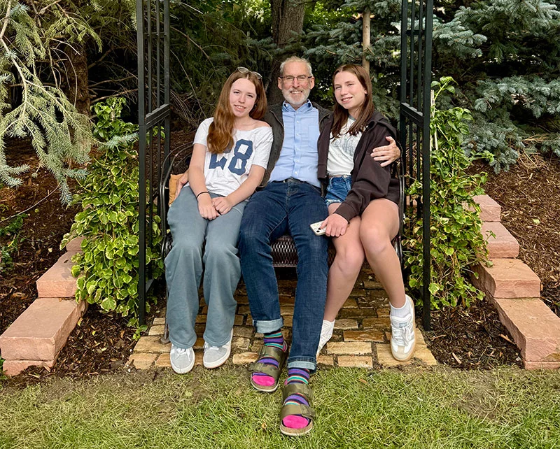 Dr. Ross Camidge with his two daughters in 2025. Photo courtesy of Dr. Ross Camidge.