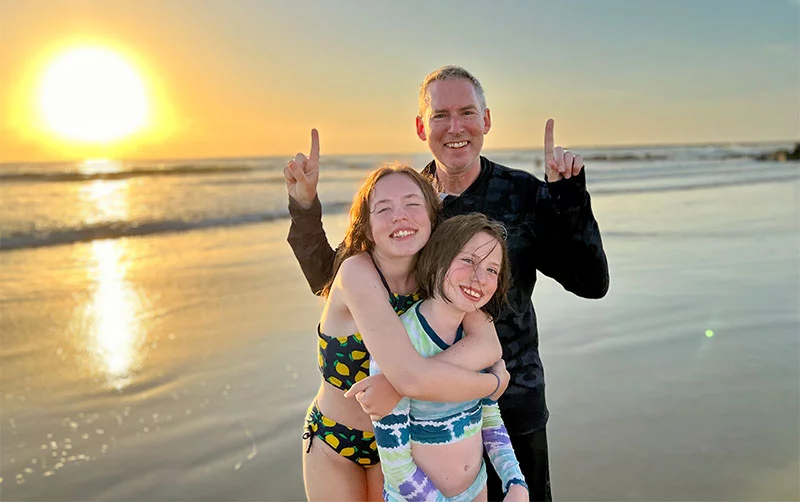 Dr. Ross Camidge with his two daughters in 2022, the same year when this lung cancer expert learned he has a rare, dangerous form of lung cancer. Photo courtesy of Dr. Ross Camidge.