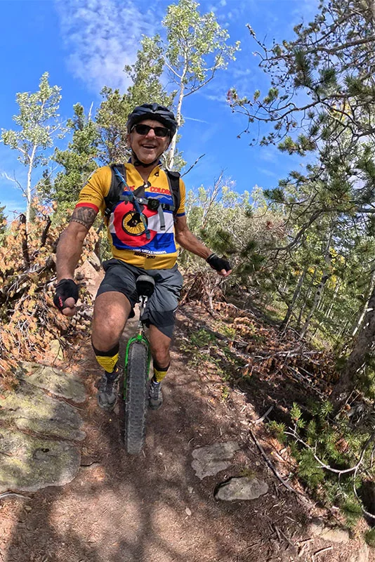 Mike Kalush rides his unicycle down Mule Deer Trail in Golden Gate Canyon State Park. Photo courtesy of Mike Kalush.