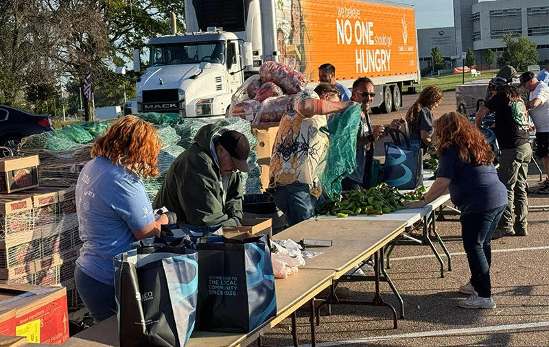 Twenty-five UCHealth employees volunteered on their days off to pack food for Heroes Helping Heroes. Volunteers filled 950 boxes for Pueblo and another 450 for Colorado Springs with nonperishable foods and lots of fresh produce donated from locals. Photo by Adam Uhernik, courtesy of Care and Share Food Bank.