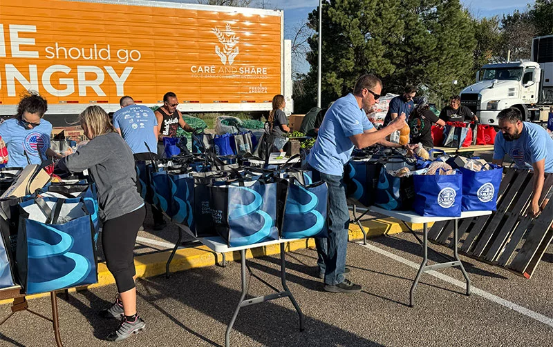 Volunteers packed boxes of nonperishable food for veterans and their families at the Heroes Helping Heroes event. Photo by Adam Uhernik, courtesy of Care and Share Food Bank.
