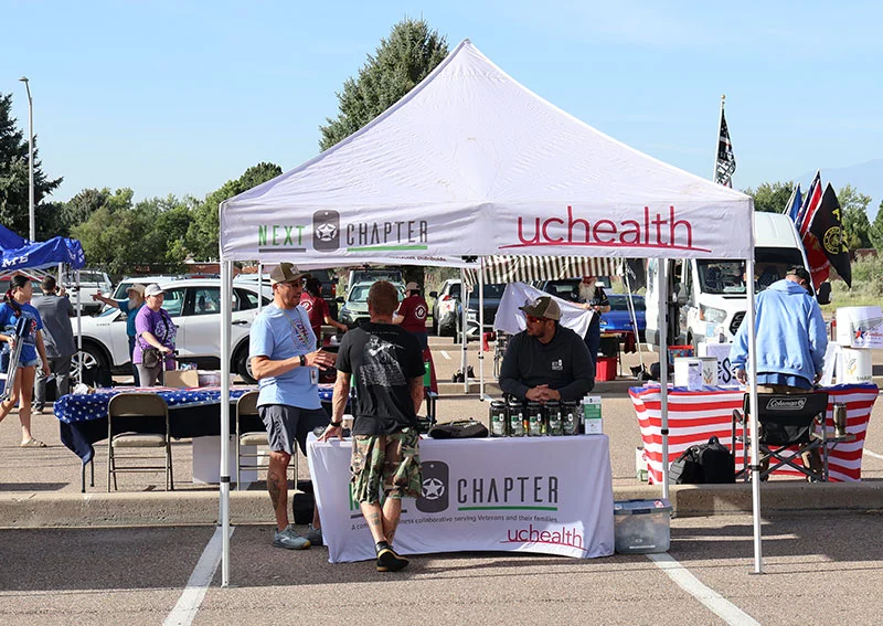 UCHealth behavioral health experts work with the Mt. Carmel Veterans Service Center to support a program called Next Chapter. Experts with Next Chapter were on hand during the Heroes Helping Heroes food drive so they could connect veterans and their families with behavioral health care and other support services. Photo by Todd Seip, UCHealth.