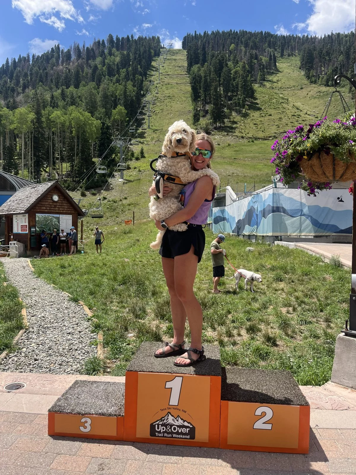 Chrissy Lofgren with her dog, Nelson, at Taos Ski Valley. Chrissy Lofgren competed in two trail running events at Taos before running the Pikes Peak Marathon. Here, she celebrates with her dog, Nelson.