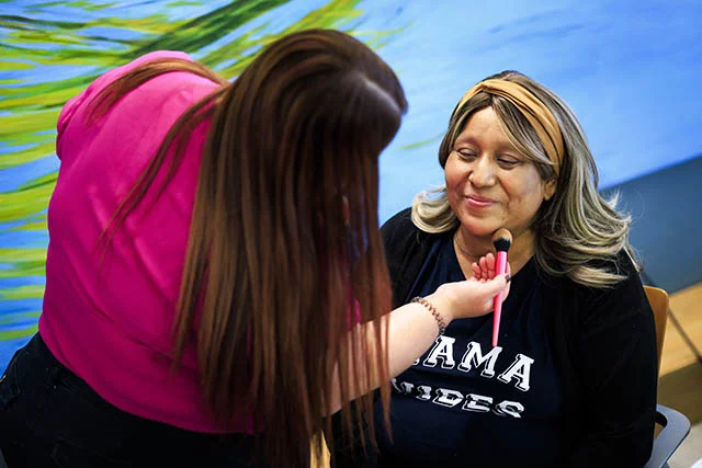 Gladiz Garcia described losing her hair as a result of chemotherapy as one of the most devastating parts of her cancer journey. During the event, she received a wig and a makeup session, helping her feel more confident and comfortable with her appearance. Photo by Michael Ciaglo for UCHealth.